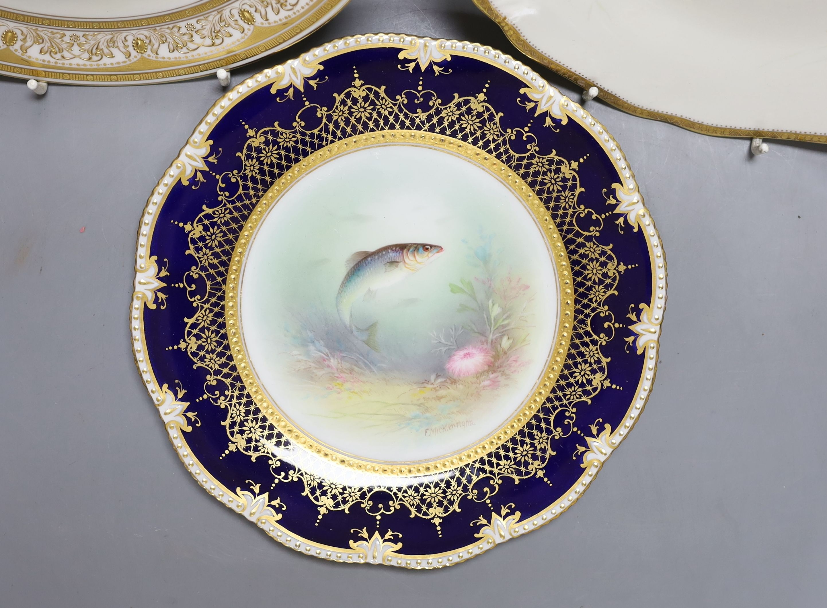 An Aynsley fish painted plate by S Micklewright, A Royal Doulton mallard or wild duck painted cabinet plate by J. Hancock and a Cauldon duck painted plate by D. Birkbeck (3)